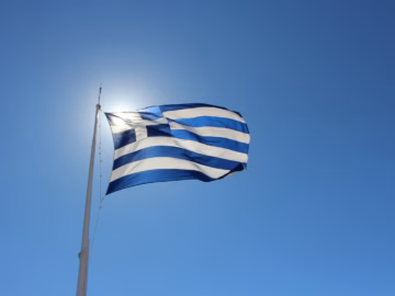 The Greek flag waving in the sun